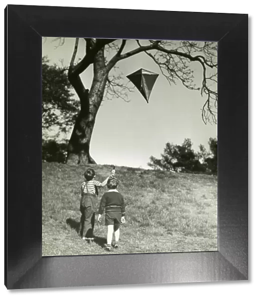 Small boys flying kite