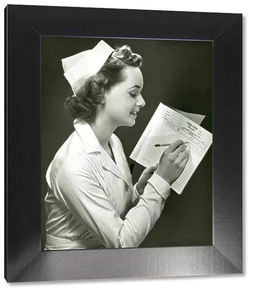 Nurse with patients medical chart