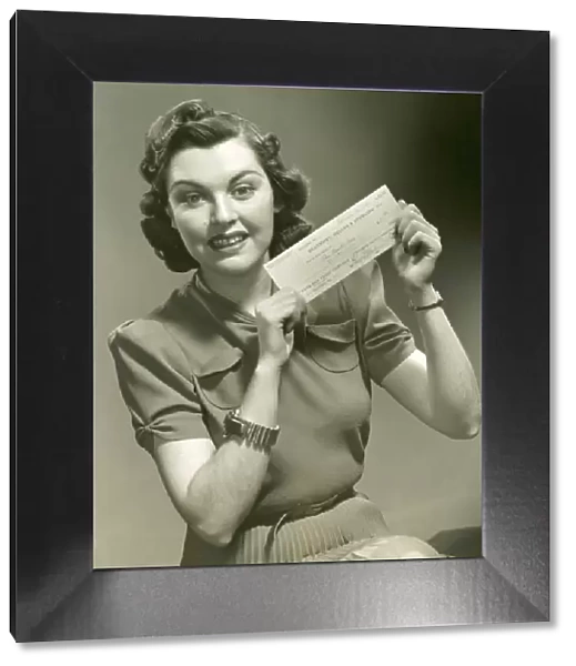 Woman holding check