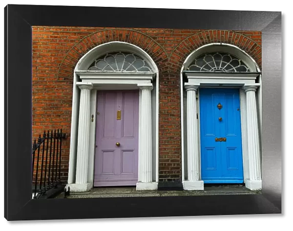Georgian architecture and painted house doors with red brick facade in Dublin city centre