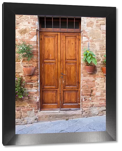 Old elegant wooden door in italian village