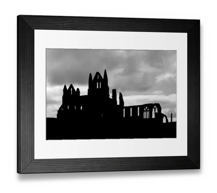 Framed Print : Whitby Abbey silhouetted against a cloudy sky, North Yorkshire, England Framed Print : Whitby Abbey silhouetted against a cloudy sky, North Yorkshire, England