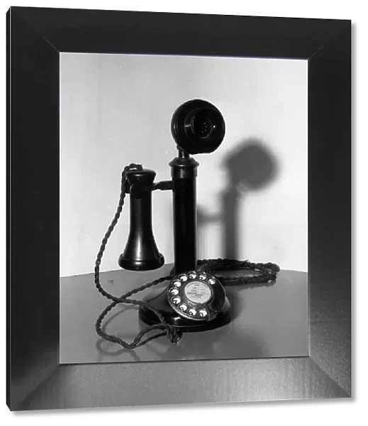 Telephone. circa 1920: An old-fashioned candlestick telephone