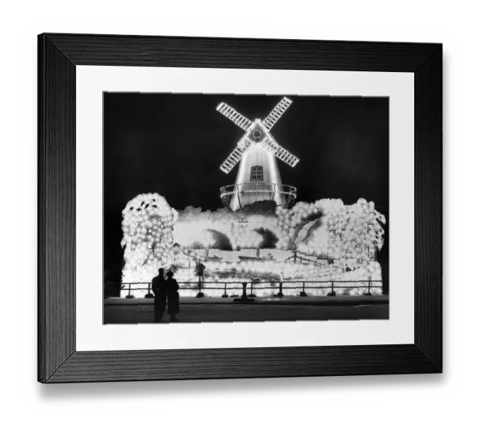 Framed Print : Well Lit. Visitors admiring the windmill, one of the illuminations at Blackpool Framed Print : Well Lit. Visitors admiring the windmill, one of the illuminations at Blackpool