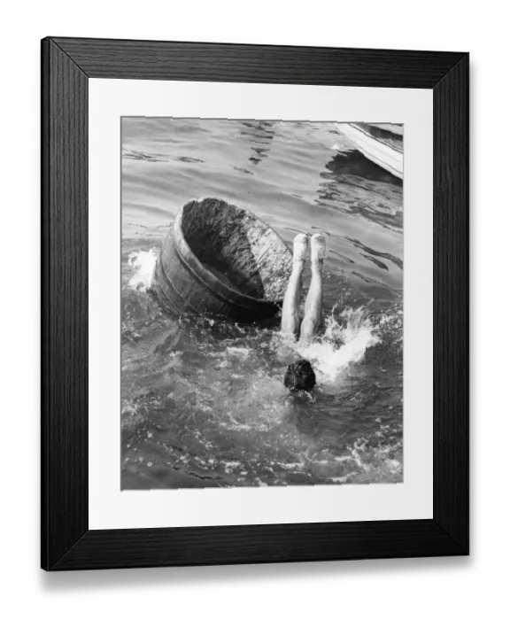 Framed Print : Splash. A competitor falling out of a tub in a tub race at Littlehampton Framed Print : Splash. A competitor falling out of a tub in a tub race at Littlehampton