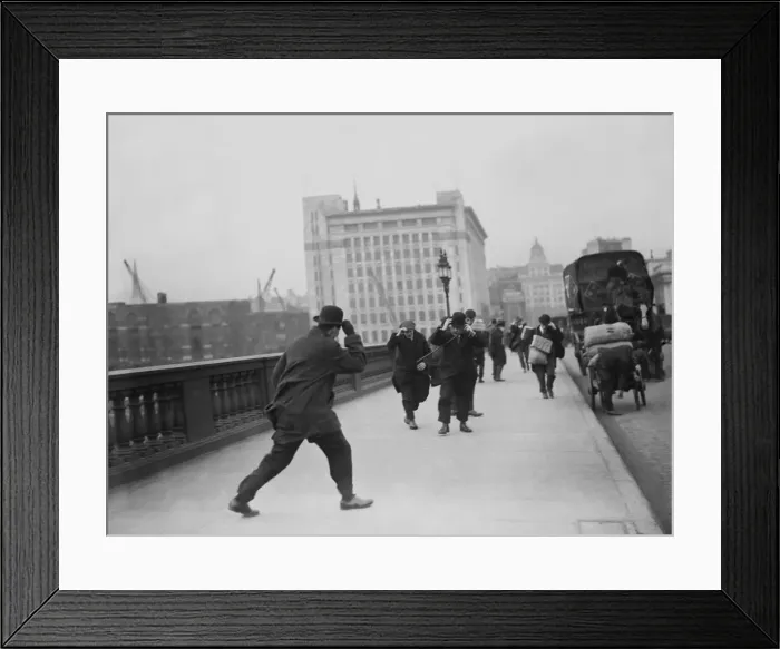 Framed Print : Windy Day. A windy day on London bridge, hats have to be firmly held on Framed Print : Windy Day. A windy day on London bridge, hats have to be firmly held on