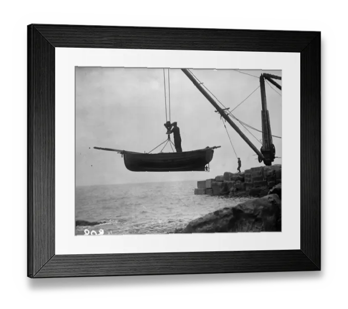Framed Print : Boat Lift. Portland fishermen lifting their boat over a rocky shore by crane and winch Framed Print : Boat Lift. Portland fishermen lifting their boat over a rocky shore by crane and winch