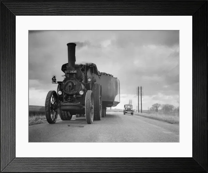 Framed Print : By Road. February 1936: A traction engine pulling an all metal barge on the road to London