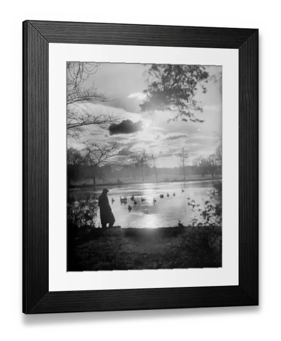 Framed Print : Twilight. 8th December 1933: A solitary figure comtemplates the setting sun over a lake Framed Print : Twilight. 8th December 1933: A solitary figure comtemplates the setting sun over a lake