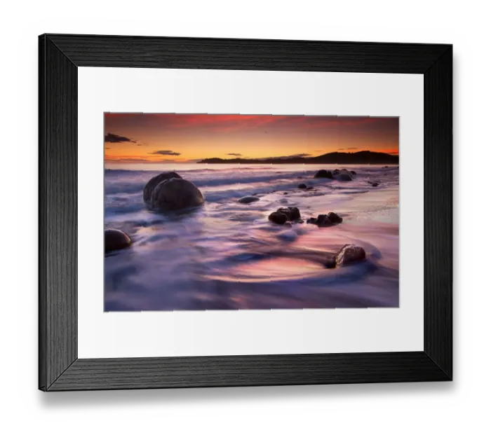 Framed Print : Round boulders on beach at sunrise Framed Print : Round boulders on beach at sunrise