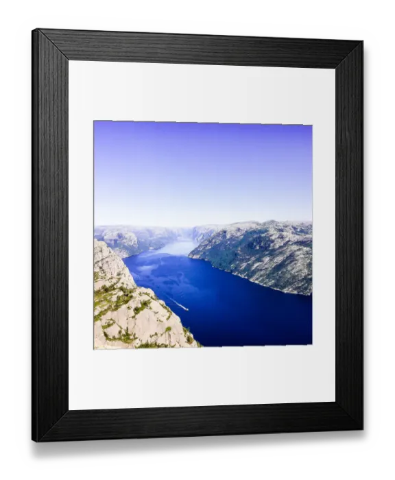 Framed Print : Lysefjord or Lysefjorden is a fjord located in the Ryfylke area in southwestern Norway. View of the fjord from the huge Preikestolen cliff, which is a major tourist destination for the region. Nature background. Image with copy space Framed Print : Lysefjord or Lysefjorden is a fjord located in the Ryfylke area in southwestern Norway. View of the fjord from the huge Preikestolen cliff, which is a major tourist destination for the region. Nature background. Image with copy space