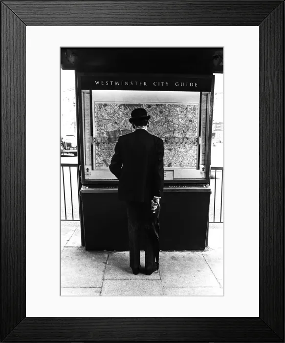 Framed Print : Gentleman in London looking at a city map Framed Print : Gentleman in London looking at a city map