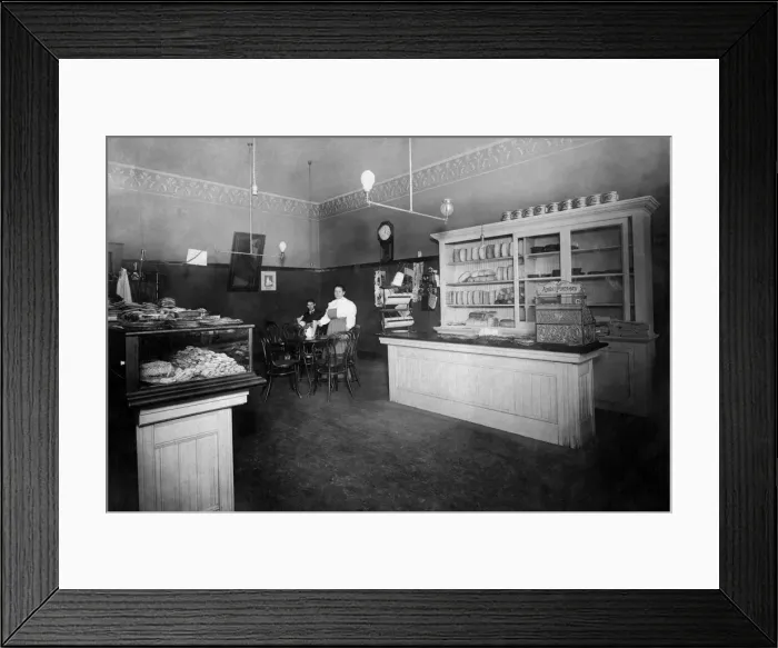 Framed Print : 521, adults, antique, bakery, black & white, caucasian, counter, eye contact, female Framed Print : 521, adults, antique, bakery, black & white, caucasian, counter, eye contact, female