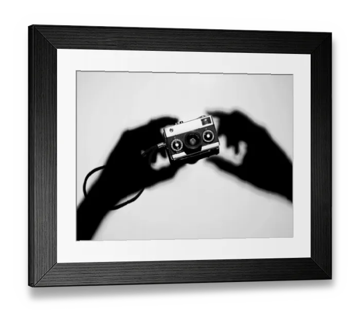 Framed Print : Shadow hands holding a camera Framed Print : Shadow hands holding a camera