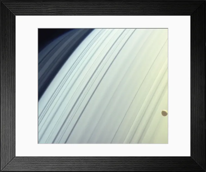 Framed Print : Moon (Mimas) orbiting Saturns northern latitudes, satellite view Framed Print : Moon (Mimas) orbiting Saturns northern latitudes, satellite view