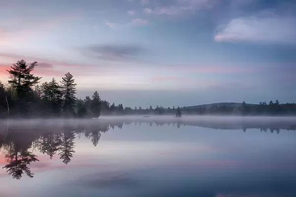 Morning reflections on Lake Durant, Adirondack Mountains, New York State, USA