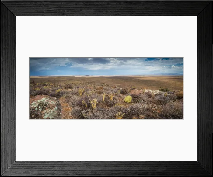 Framed Print : Panoramic views over the Tankwa Karoo Desert with dramatic thunderclouds in the sky Framed Print : Panoramic views over the Tankwa Karoo Desert with dramatic thunderclouds in the sky