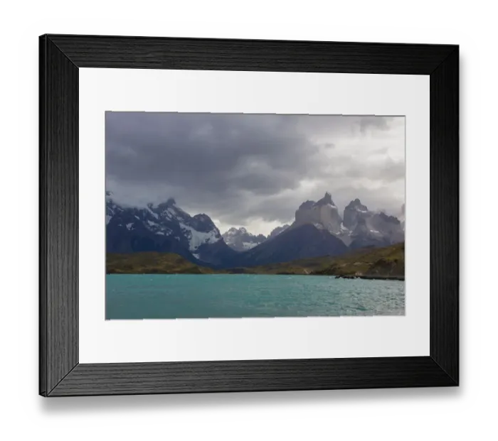 Framed Print : Looking across the cold waters of Lake Pehue to the snow-capped mountain peaks of the Torres del Paine National Park in the Magallanes Region of Patagonia, Southern Chile Framed Print : Looking across the cold waters of Lake Pehue to the snow-capped mountain peaks of the Torres del Paine National Park in the Magallanes Region of Patagonia, Southern Chile