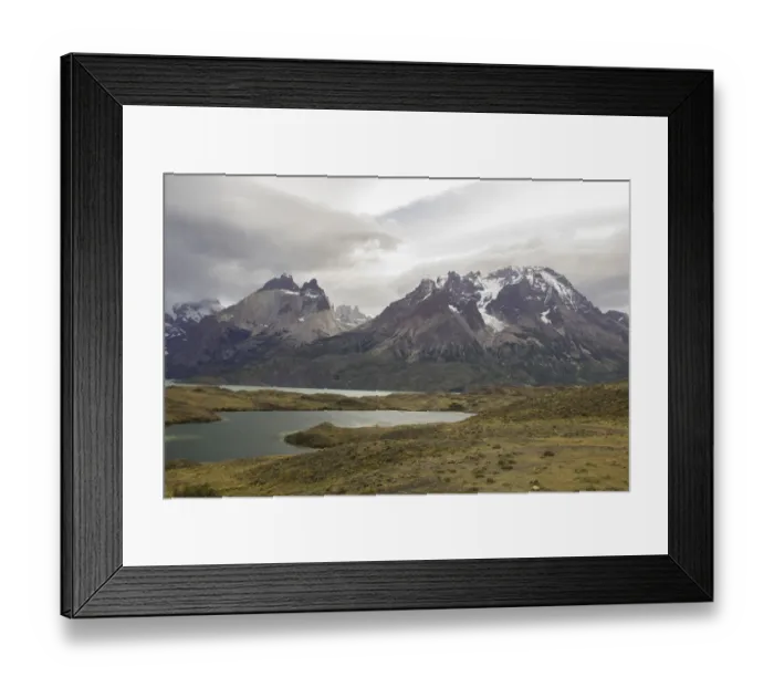 Framed Print : Looking across the cold waters of Lake Nordenskjold to the snow-capped mountain peaks of the Torres del Paine National Park in the Magallanes Region of Patagonia, Southern Chile Framed Print : Looking across the cold waters of Lake Nordenskjold to the snow-capped mountain peaks of the Torres del Paine National Park in the Magallanes Region of Patagonia, Southern Chile