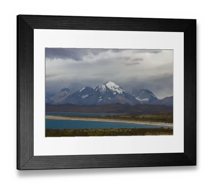Framed Print : Looking across the turquoise waters of Lake Sarmiento to the snow-capped mountain peaks of the Torres del Paine National Park in the Magallanes Region of Patagonia, Southern Chile Framed Print : Looking across the turquoise waters of Lake Sarmiento to the snow-capped mountain peaks of the Torres del Paine National Park in the Magallanes Region of Patagonia, Southern Chile