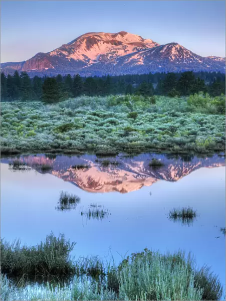 Reflection of Mammoth Mountain in pond, California, USA