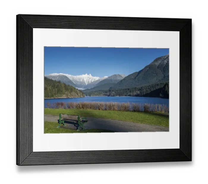 Framed Print : Snow-capped mountains above lake and meadow with bench, British Columbia, Canada Framed Print : Snow-capped mountains above lake and meadow with bench, British Columbia, Canada