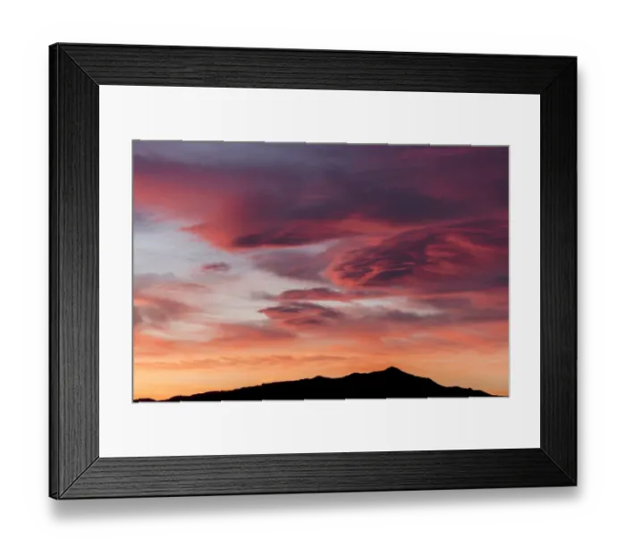 Framed Print : Sunset lights up clouds above mountain ridge in Joshua Tree National Parks southern region, California, USA Framed Print : Sunset lights up clouds above mountain ridge in Joshua Tree National Parks southern region, California, USA