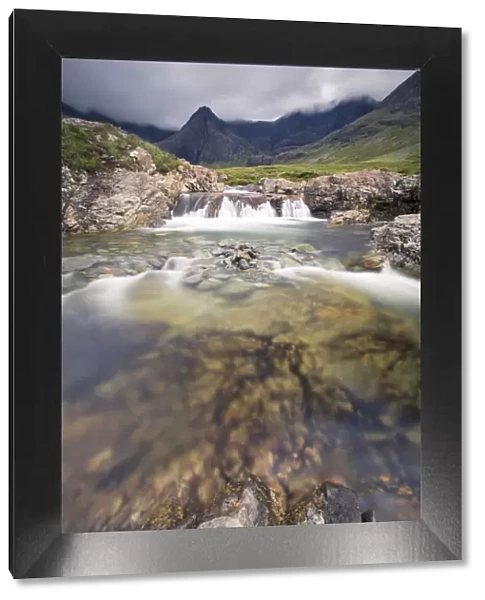 Waterfall in Fairy Pools rocky stream on Isle of Skye Scotland Europe