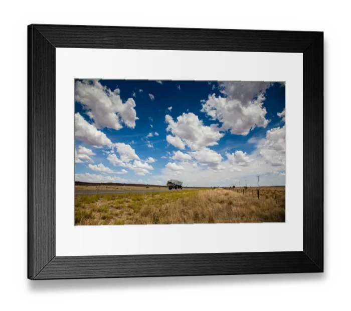 Framed Print : A truck travels along the N12 in the dry and arid landscape in the Northern Cape Framed Print : A truck travels along the N12 in the dry and arid landscape in the Northern Cape