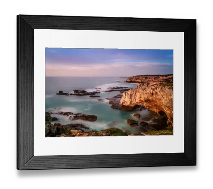 Framed Print : The dangerous and rugged coastline of Arniston where many shipwrecks have taken place with sunrise painting the cliff face and clouds with color. Arniston, Western Cape Province, South Africa Framed Print : The dangerous and rugged coastline of Arniston where many shipwrecks have taken place with sunrise painting the cliff face and clouds with color. Arniston, Western Cape Province, South Africa