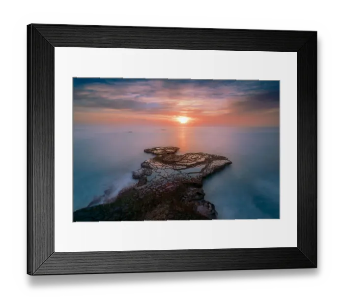 Framed Print : A rocky outcrop reaching out to the sun peeping through the clouds at Arniston with a long exposure smoothing out the water and providing the pastel shades of pink and blue. Arniston, Western Cape Province, South Africa Framed Print : A rocky outcrop reaching out to the sun peeping through the clouds at Arniston with a long exposure smoothing out the water and providing the pastel shades of pink and blue. Arniston, Western Cape Province, South Africa