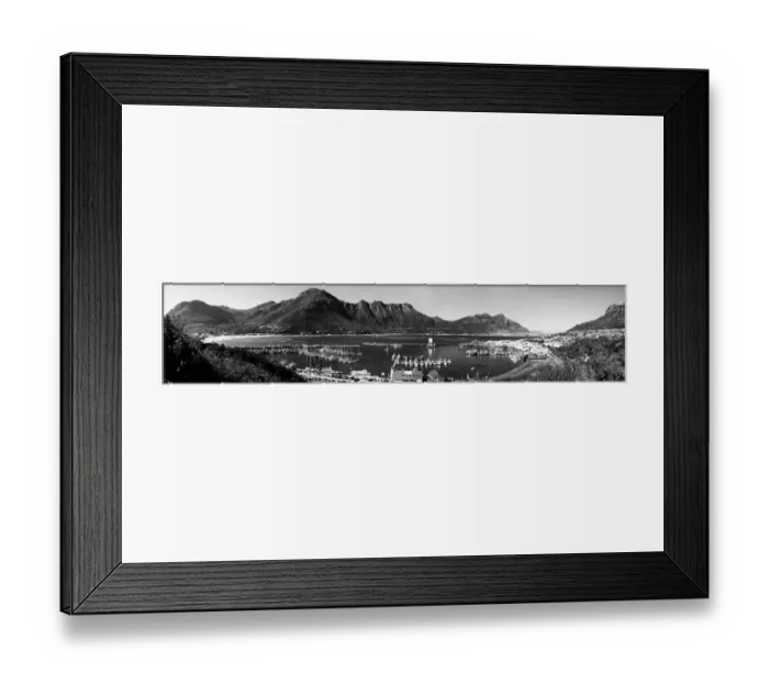 Framed Print : A black and white panoramic picture of Hout Bay with Hout Bay Beach on the left and the marina and fishing harbour in the foreground. Chapmans Peak is in the background. Western Cape Province, South Africa Framed Print : A black and white panoramic picture of Hout Bay with Hout Bay Beach on the left and the marina and fishing harbour in the foreground. Chapmans Peak is in the background. Western Cape Province, South Africa