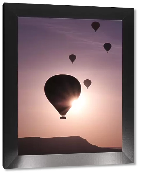 Hot air balloons flying above rock formations, Goreme National Park, Goreme, Cappadocia, Anatolia, Turkey