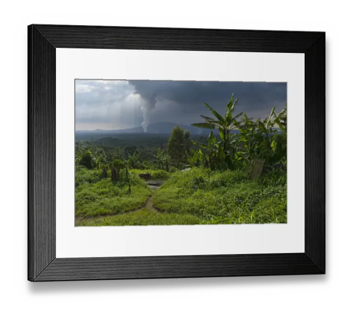 Framed Print : Rural dwelling with erupting Nyamuragira Volcano in background, Virunga National Park, Parq National des Virunga, Democratic Republic of Congo Framed Print : Rural dwelling with erupting Nyamuragira Volcano in background, Virunga National Park, Parq National des Virunga, Democratic Republic of Congo