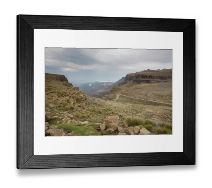 Framed Print : Landscape shot of 4x4 vehicles driving Sani Pass on the border of KwaZulu-Natal, South Africa and Thaba-Tseka, Lesotho Framed Print : Landscape shot of 4x4 vehicles driving Sani Pass on the border of KwaZulu-Natal, South Africa and Thaba-Tseka, Lesotho