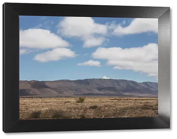Wide angle shot of dry desert field with clouds, Western Cape Province, South Africa