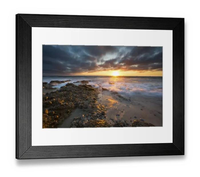Framed Print : Sunrise landscape of ocean with waves clouds and rocks on beach Framed Print : Sunrise landscape of ocean with waves clouds and rocks on beach