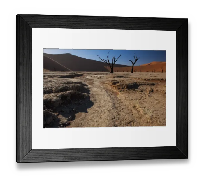 Framed Print : Hot desert sun rises over the iconic dead tree landscape of Deadvlei in the Namib-Naukluft National Park, Namibia Framed Print : Hot desert sun rises over the iconic dead tree landscape of Deadvlei in the Namib-Naukluft National Park, Namibia