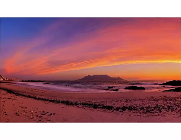 Dramatic Pink Sunset over Table Mountain from Blauwbergstrand Beach, Cape Town, Western Province, South Africa