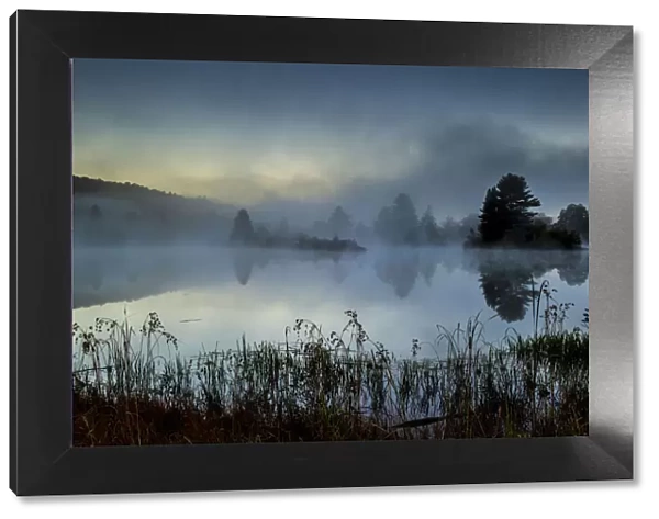 Streeter Pond in fog at dawn, New Hampshire, USA