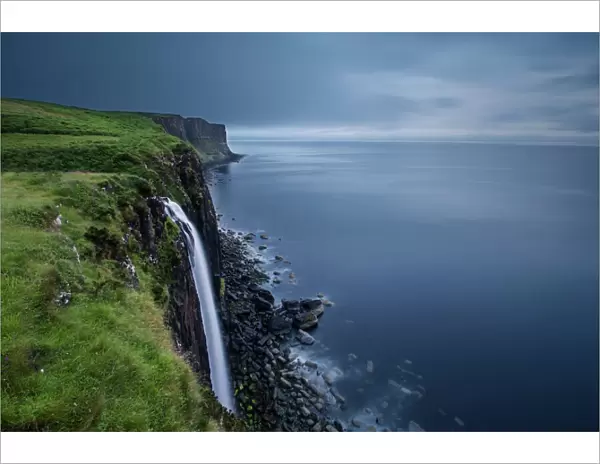 Waterfall at Kilt Rock on Isle of Skye on a gloomy cloudy morning