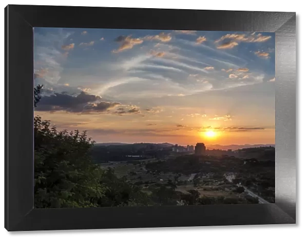 Panoramic photo of the Voortrekker Monument at sunset with a view of the Magaliesburg Mountains in the Background, Pretoria, Gauteng Province, South Africa