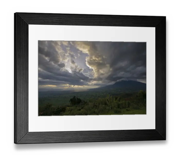 Framed Print : Sunset over the Virunga Mountains of the Volcanoes National Park in Rwanda with the rural settlements dotting the landscape Framed Print : Sunset over the Virunga Mountains of the Volcanoes National Park in Rwanda with the rural settlements dotting the landscape