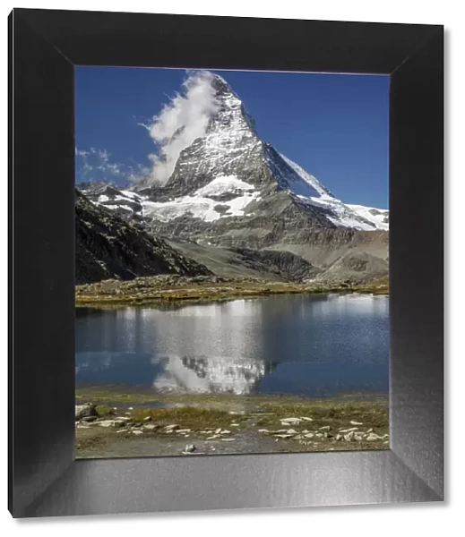 Matterhorn reflected in Riffelsee, Zermatt, Valais Canton, Switzerland
