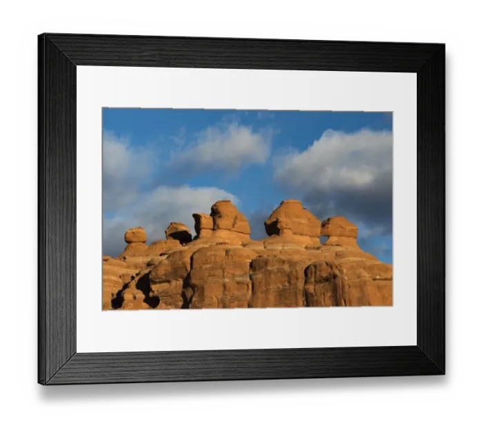 Framed Print : Eroded rock formations at sunset in Arches National Park with clouds, Utah, USA Framed Print : Eroded rock formations at sunset in Arches National Park with clouds, Utah, USA