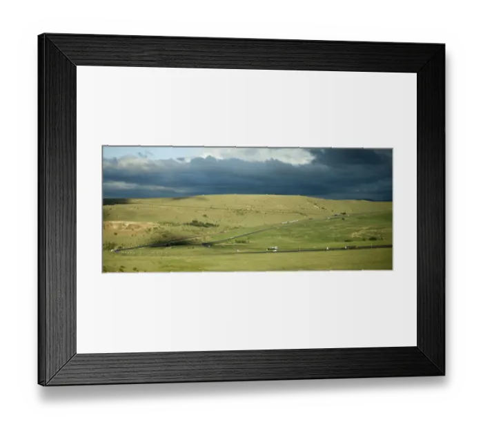 Framed Print : car, cloud, color image, day, field, grass, highway, hill, horizontal, landscape Framed Print : car, cloud, color image, day, field, grass, highway, hill, horizontal, landscape