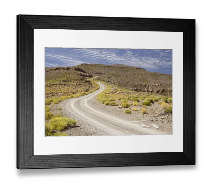 Framed Print : color image, day, daytime, dirt road, hill, horizontal, landscape, mountain road Framed Print : color image, day, daytime, dirt road, hill, horizontal, landscape, mountain road