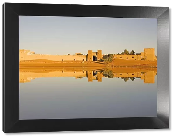 Reflection of Moroccan City Walls in a Dam