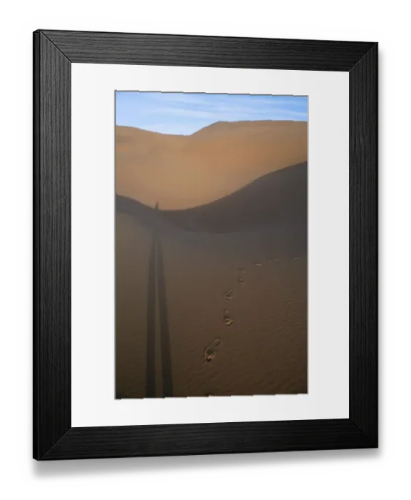 Framed Print : Footprints in the Sand with Elongated Shadow Framed Print : Footprints in the Sand with Elongated Shadow