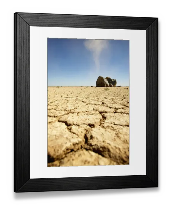 Framed Print : Dry Cracked Soil in Foreground with Boulders in Background Framed Print : Dry Cracked Soil in Foreground with Boulders in Background